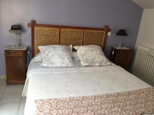 a bedroom with a large bed with two night stands at La Jourdane in Saint-Alexandre +30 photos