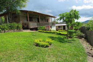 a yard in front of a house at Gateway Guest House in Monkey Bay