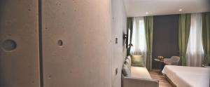 Posteľ alebo postele v izbe v ubytovaní Hotel Maison Ducal