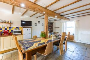 a kitchen with a dining room table and chairs at Bamse B&B in Montrose