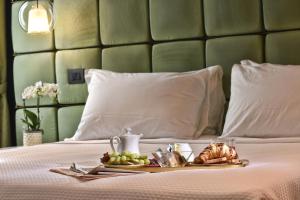 Posteľ alebo postele v izbe v ubytovaní Hotel Maison Ducal