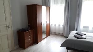 Łóżko lub łóżka w pokoju w obiekcie Apartament Paderewskiego 11