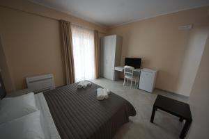 Posteľ alebo postele v izbe v ubytovaní L'AURORA