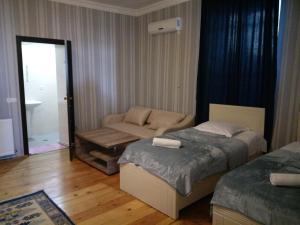 Postel nebo postele na pokoji v ubytování Abramichi Guest House