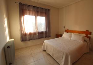 Säng eller sängar i ett rum på Hostal Sierra de Gredos