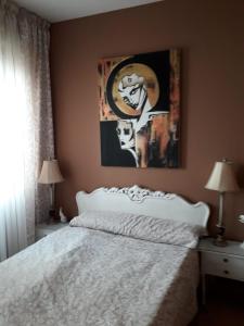 Ένα ή περισσότερα κρεβάτια σε δωμάτιο στο Carrer Roma