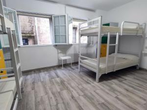 מיטה או מיטות בחדר ב-A Barca de Pedra