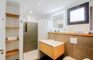 a bathroom with a sink and a mirror at Residence Kalliste in Ajaccio