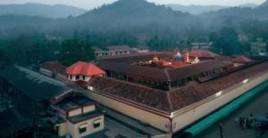 an overhead view of a building with mountains in the background at Paradise Wild Hills Kodachadri in Kollūru