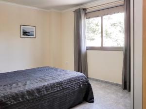 A bed or beds in a room at Casa Julia 2 gran piso vistas playa Las Teresitas 4 pax
