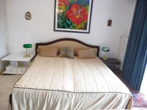 a bedroom with a large bed with blue curtains at Ferienhaus Werthmann in Mittenwald