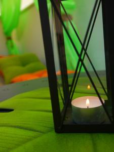a candle sitting on a table in a room at Hotel Maravillas del Mundo in Calpe