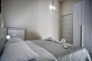 a bedroom with a bed with towels on it at Luxury View Apartment in Casola di Napoli