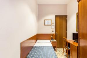Postel nebo postele na pokoji v ubytování Hotel Tempio Di Pallade