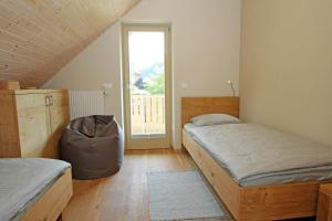 Postel nebo postele na pokoji v ubytování Apartma - Počitniška hiša Lodi