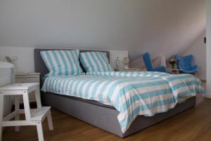 Ein Bett oder Betten in einem Zimmer der Unterkunft Ankerhaus Ostholstein