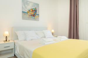 Postel nebo postele na pokoji v ubytování Holiday Apartments Dubrovnik