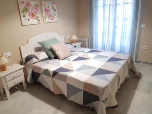 Katil atau katil-katil dalam bilik di Apartamento Pinar del Atlántico-La Barrosa