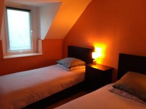 Postel nebo postele na pokoji v ubytování La Maison de Leonie