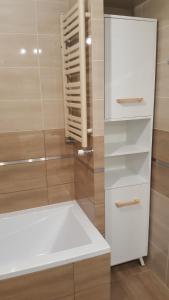 Kúpeľňa v ubytovaní Apartament z widokiem-Bliżej Zdroju
