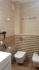Kúpeľňa v ubytovaní Apartament z widokiem-Bliżej Zdroju