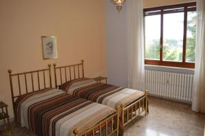 A bed or beds in a room at Villa Paulette