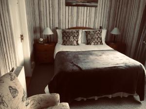 سرير أو أسرّة في غرفة في Barrow View Accommodation