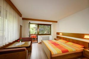 En eller flere senge i et værelse på Apparthotel Taufenbrunn