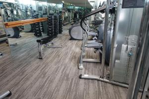 a gym with rows of treadmills and machines at State Plaza Hotel in Washington