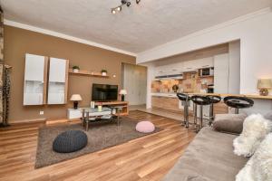 a living room with a couch and a table at Mammut Apartment Budapest in Budapest