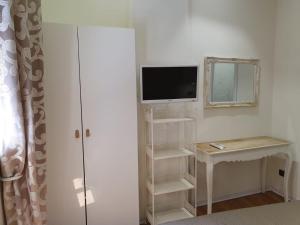 TV a/nebo společenská místnost v ubytování Guest House Piazza Carmine
