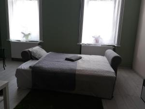 Postel nebo postele na pokoji v ubytování HEMNES Apartman