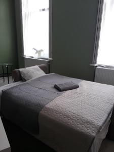Postel nebo postele na pokoji v ubytování HEMNES Apartman