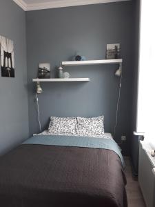 Postel nebo postele na pokoji v ubytování HEMNES Apartman