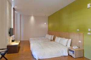 Postel nebo postele na pokoji v ubytování In Young Hotel
