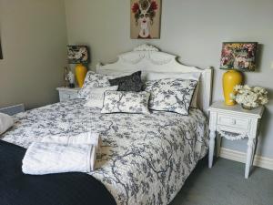 a bedroom with a bed with pillows on it at Nicholson BnB and Arts Centre in Nicholson