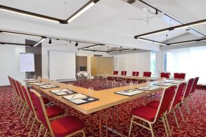 a large conference room with a long table and chairs at Landhotel Böld Oberammergau in Oberammergau