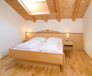 Postel nebo postele na pokoji v ubytování Penthouse Kurz