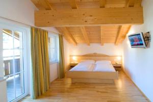 Postel nebo postele na pokoji v ubytování Penthouse Kurz