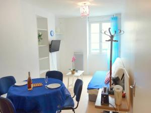 a room with a table and a bed in a room at Apartment Le Vieux Port by Interhome in Cancale