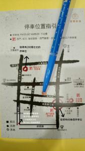 a blue pen sitting on top of a menu at King Wow Inn in Tainan