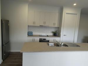 a kitchen with a sink and a counter top at 123 Wilson - Arapiles in Horsham