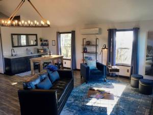 a living room with a couch and a table at Papillon Cellars - The Loft in Mariposa