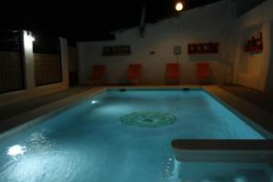 The swimming pool at or close to Casa Rural Asiento del Río