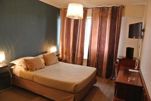 Postel nebo postele na pokoji v ubytování Hôtel Albion