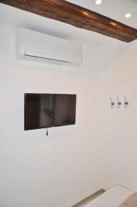 A television and/or entertainment centre at The Best View Of The Sea