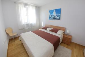 Postel nebo postele na pokoji v ubytování Lila Apartments