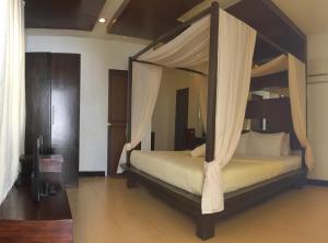 Ένα ή περισσότερα κρεβάτια σε δωμάτιο στο Seabird International Resort