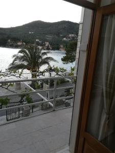 a view of the water from a balcony at Villa Kukuljica in Zaton