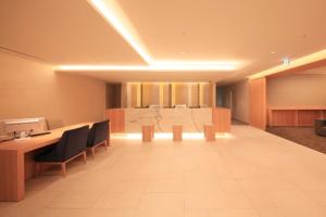 a large room with a table and chairs in a room at Richmond Hotel Tenjin Nishi-Dori in Fukuoka